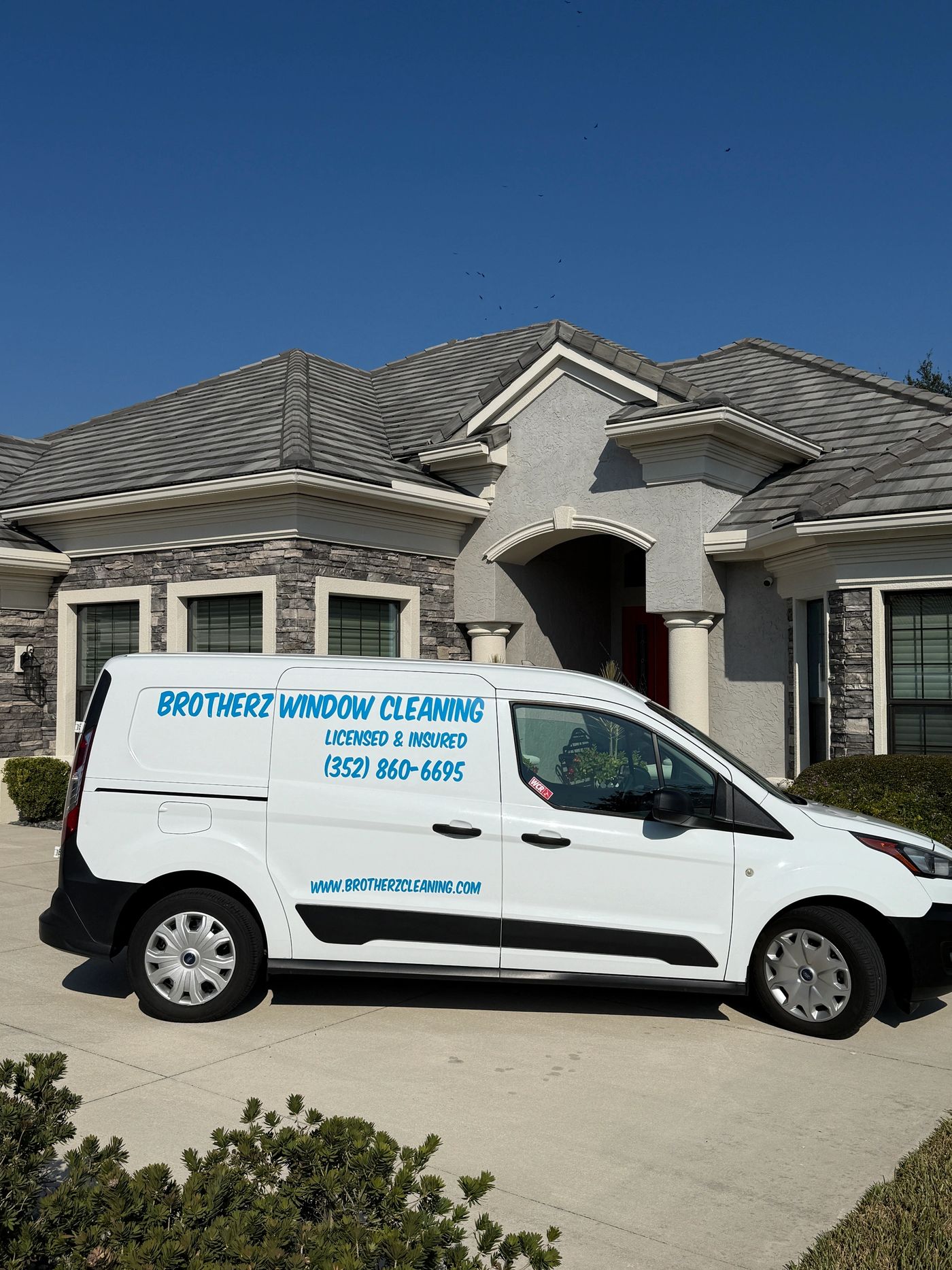 The Brotherz Window Cleaning van parked in the driveway of a Citrus County home